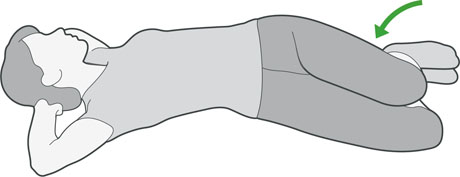 A diagram of someone lying on their back rolling their knees from side to side, which is an exercise to help with back pain.