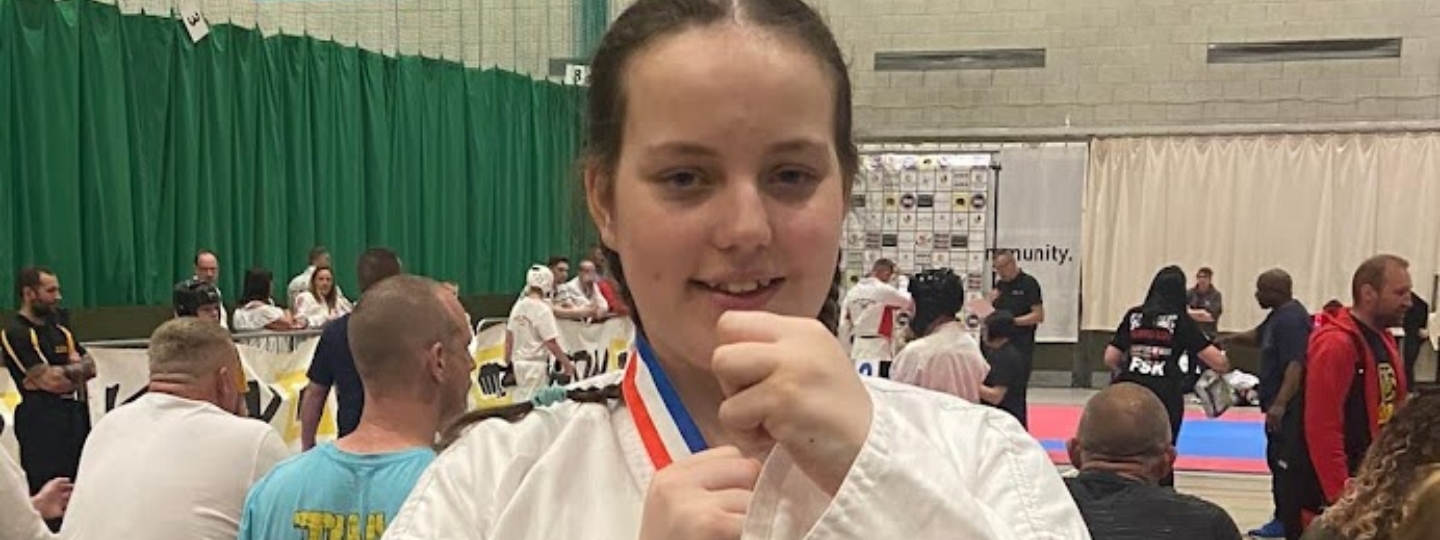 Holly wearing karate uniform