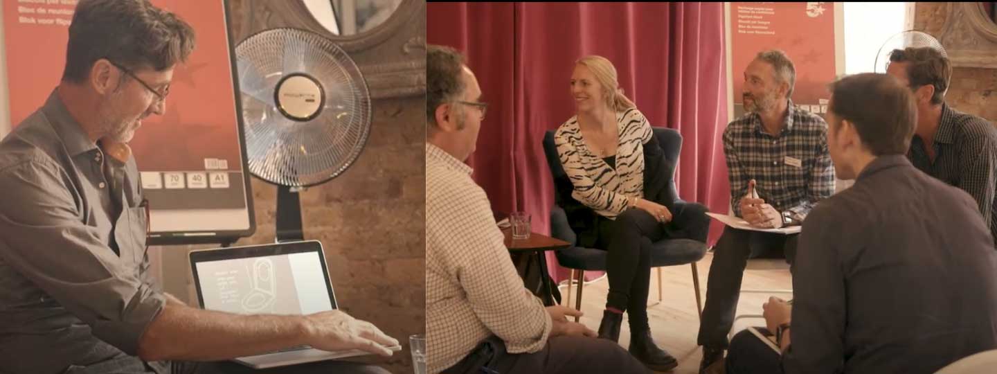 Man showing a design on a laptop and a group of people talking about products to help at home.