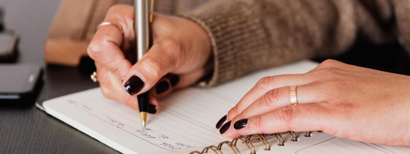 Woman writing in diary