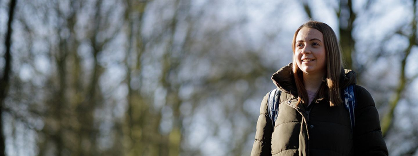 Young woman smiling in the woods 