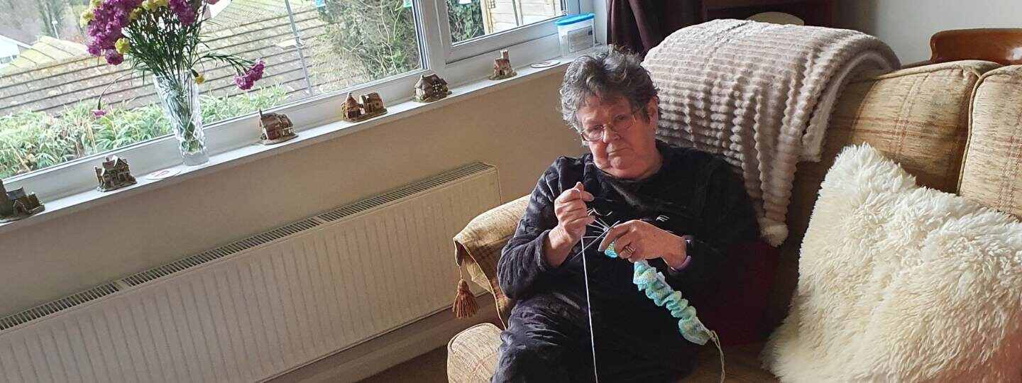 Margaret knitting at home