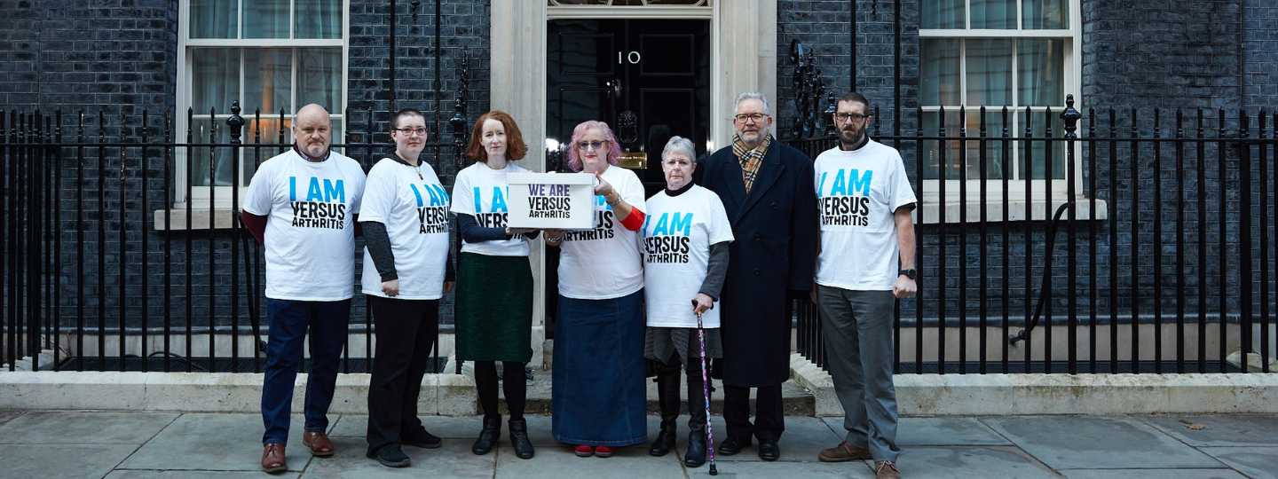 Versus Arthritis team and campaigners delivering letter to No 10 Downing Street