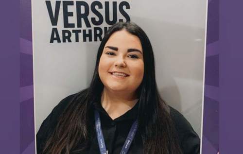 Georgia holding Versus Arthritis sign