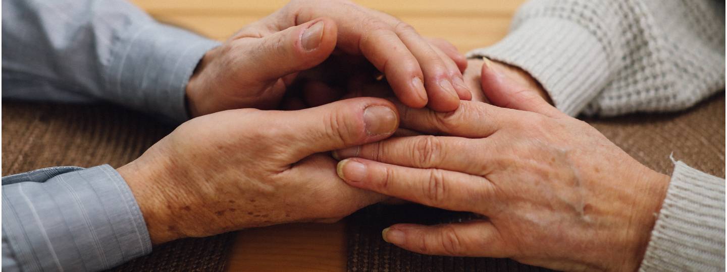 Two people holding hands