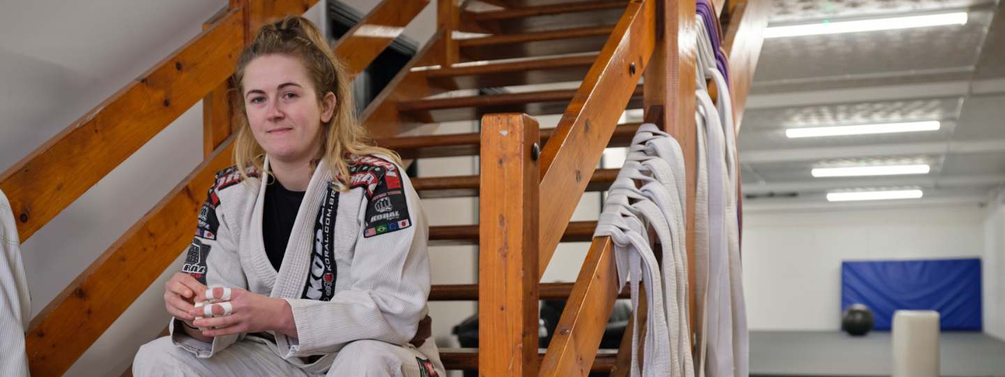 Young woman wearing ju-jitsu outfit