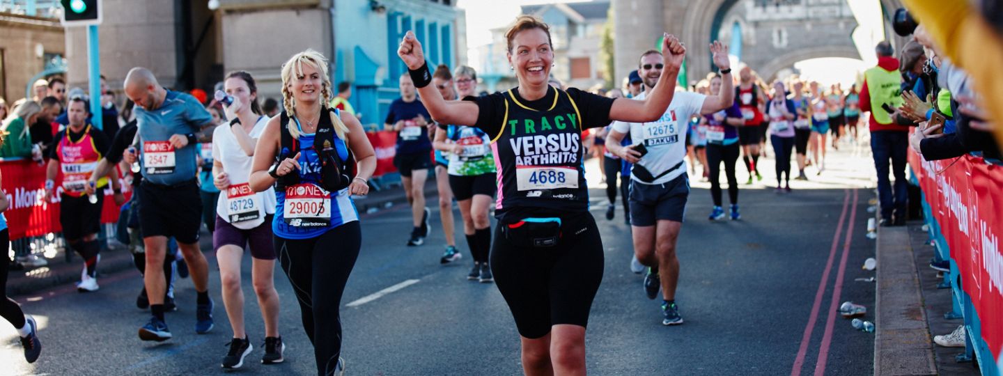 Smiling woman running London Marathon