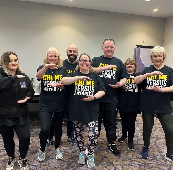 A group of people participating in a Chi Me class