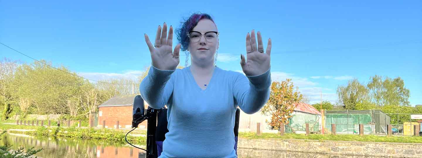 Heather In Wheelchair Sits By The River