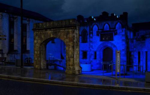 Building lit up blue for World Arthritis Day in Northern Ireland