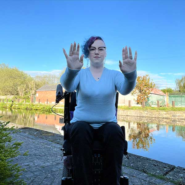 Heather In Wheelchair Sits By The River