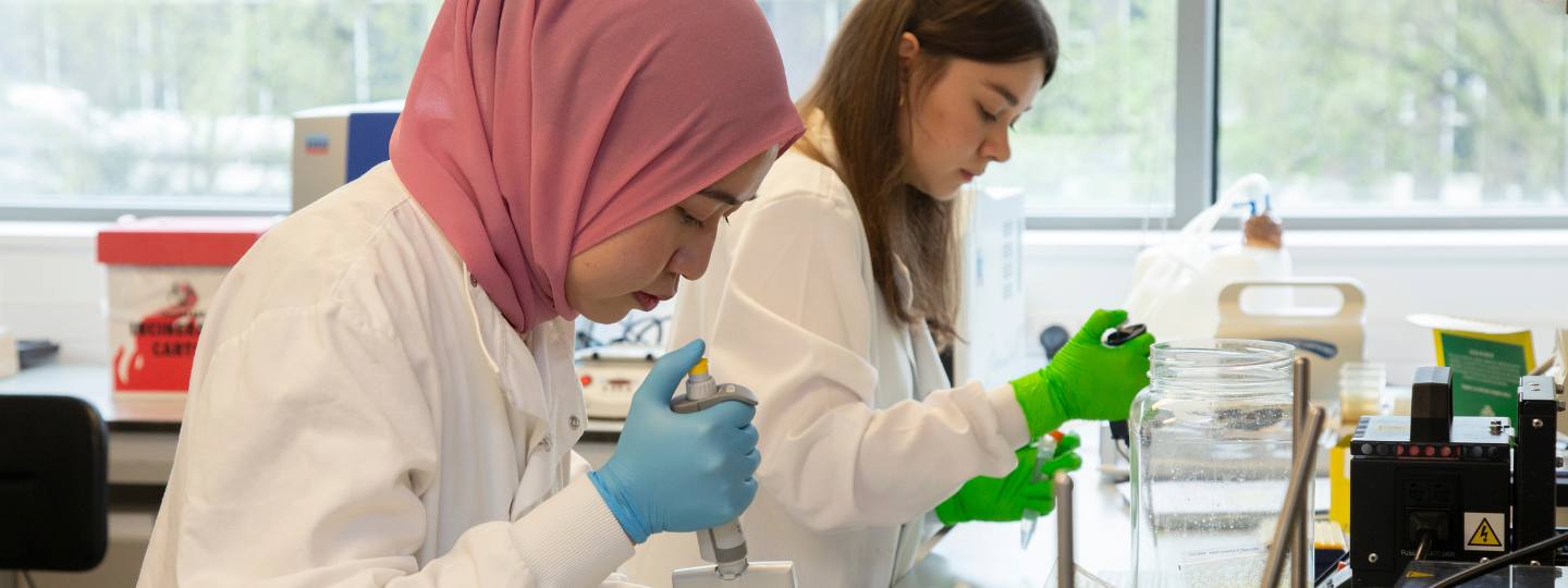 Two women researchers working in a laboratory 
