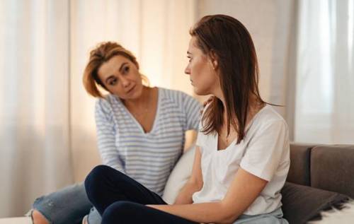 Mother listening to worried daughter