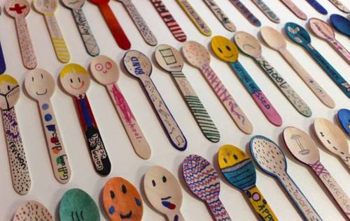 Wooden spoons decorated in colourful illustrations using markers