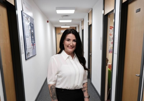 Smiling Yeliz wearing white shirt