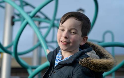 William climbing on blue climbing frame