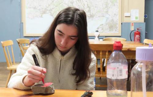 Gabi colouring in stone in classroom