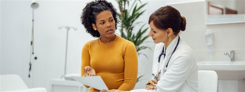 Female doctor speaking to her patient