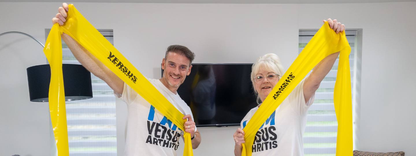 Leon and him mum Janet holding yellow resistance bands 