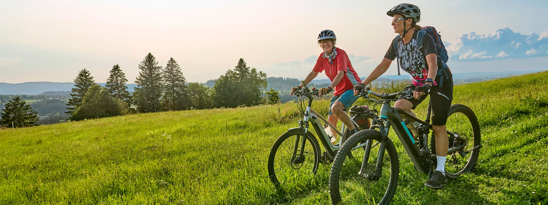Two women cycling in the countryside
